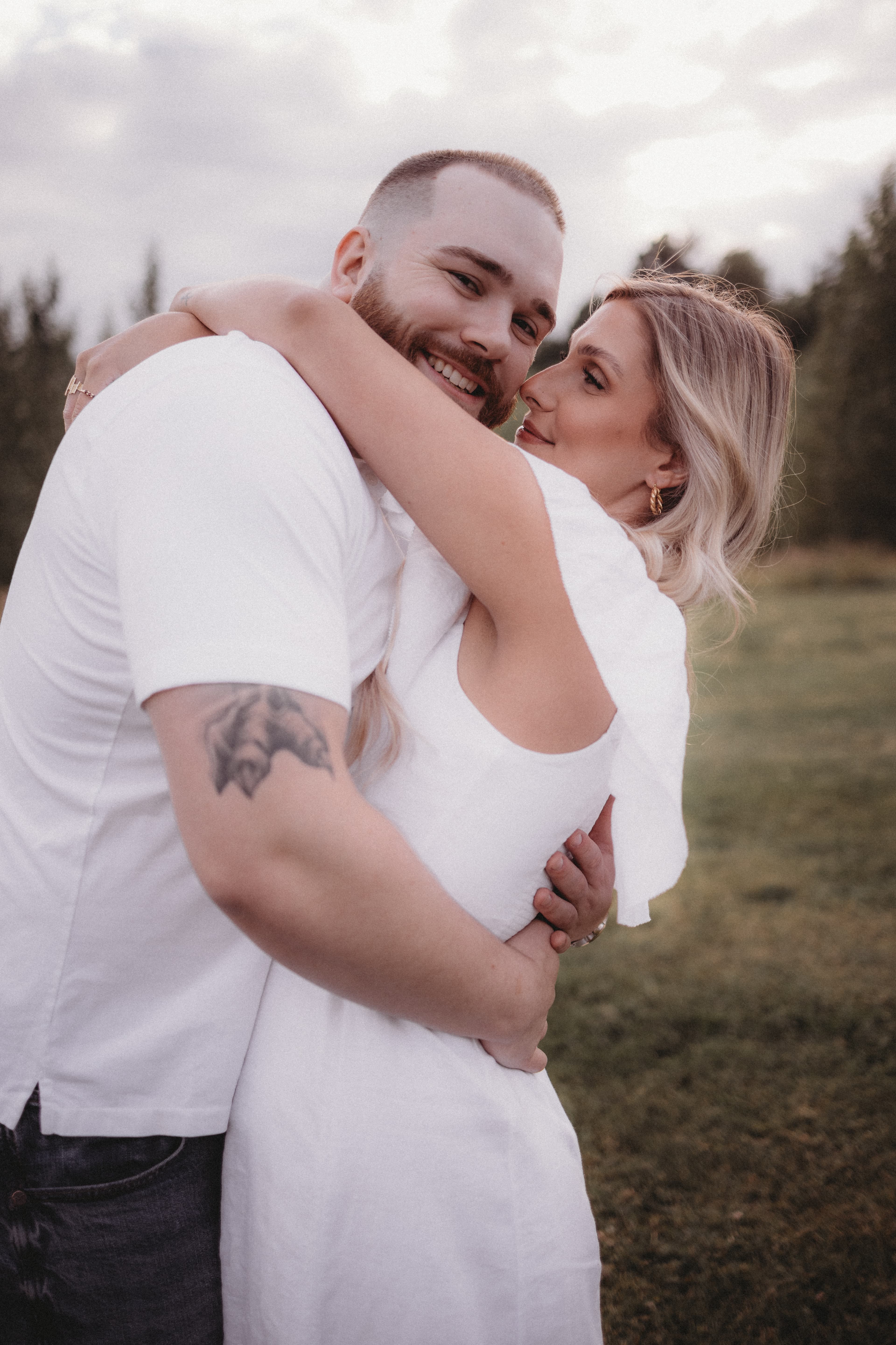 Matthew and Robyn embracing outdoors